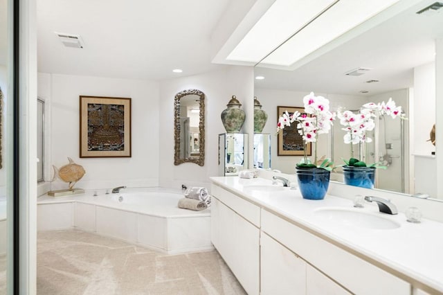 bathroom featuring plus walk in shower and vanity