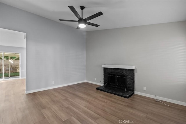 unfurnished living room with ceiling fan and hardwood / wood-style flooring