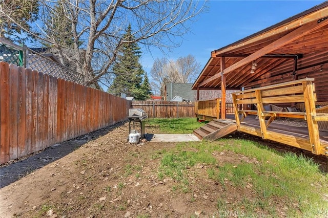 view of yard featuring a wooden deck