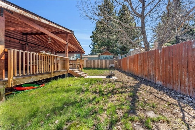 view of yard with a wooden deck