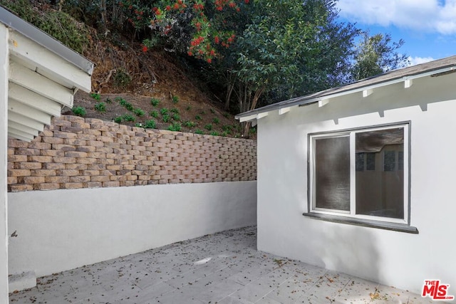 view of side of home featuring a patio