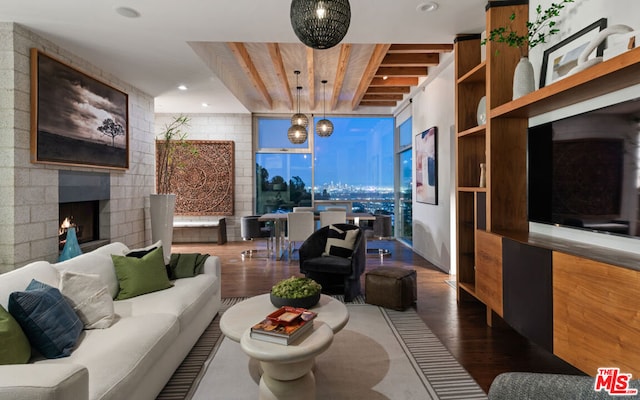 living room with hardwood / wood-style flooring and a fireplace