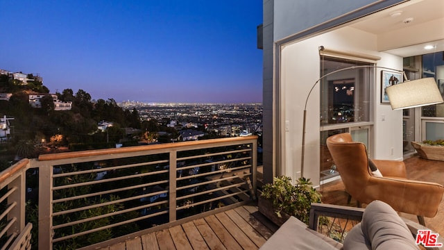 view of balcony at dusk