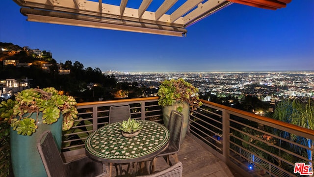 balcony at dusk with a pergola