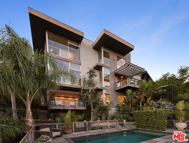 exterior space featuring a fenced in pool