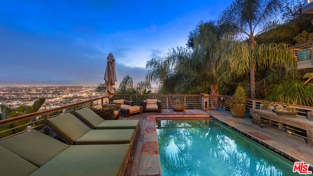 view of pool at dusk