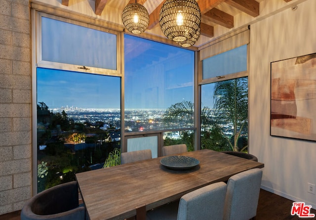 sunroom / solarium featuring beam ceiling