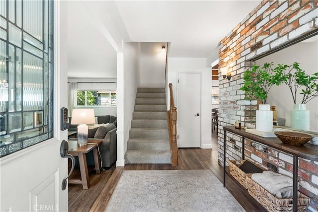 stairs with hardwood / wood-style floors