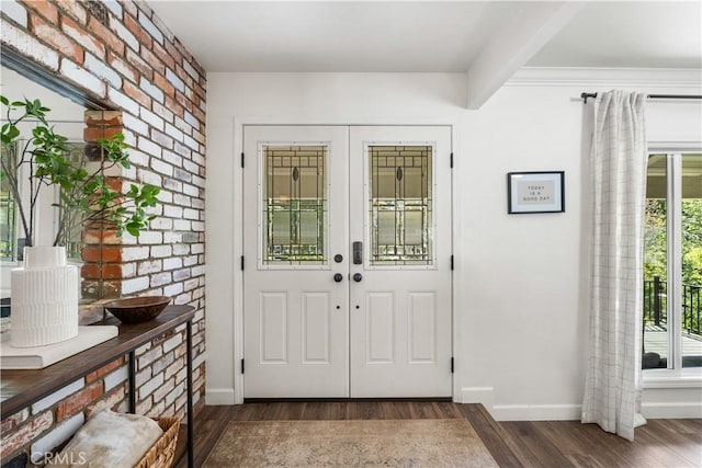 entryway with beam ceiling and dark hardwood / wood-style flooring