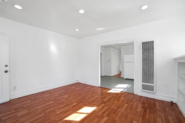 empty room featuring dark hardwood / wood-style floors