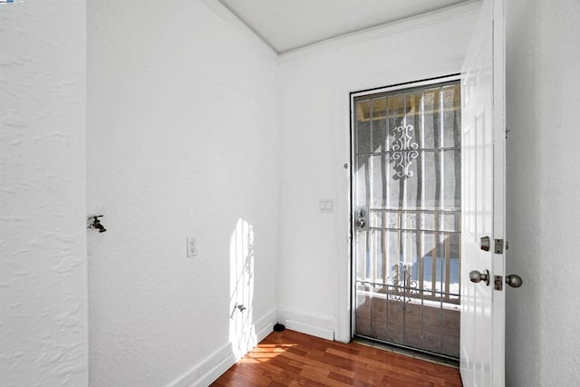 interior space with hardwood / wood-style floors, crown molding, and plenty of natural light