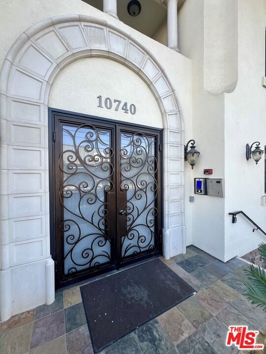 doorway to property with french doors