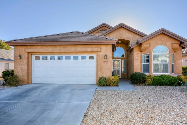 view of front of property with a garage