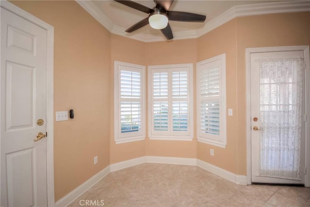 entryway with ceiling fan and crown molding