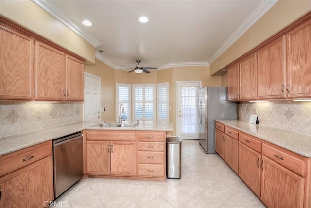 kitchen featuring sink, crown molding, ceiling fan, kitchen peninsula, and stainless steel appliances