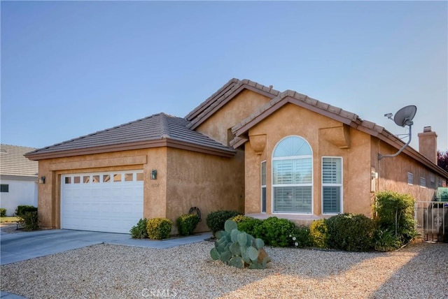 ranch-style home featuring a garage