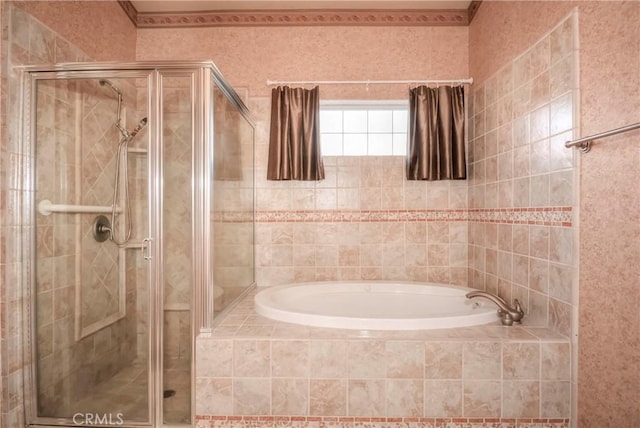 bathroom featuring separate shower and tub