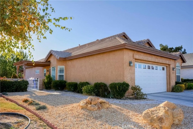 view of side of property with a garage