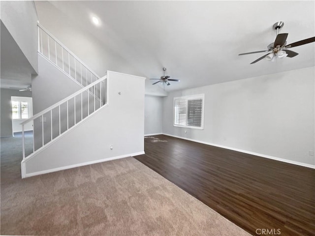 unfurnished living room with dark hardwood / wood-style flooring