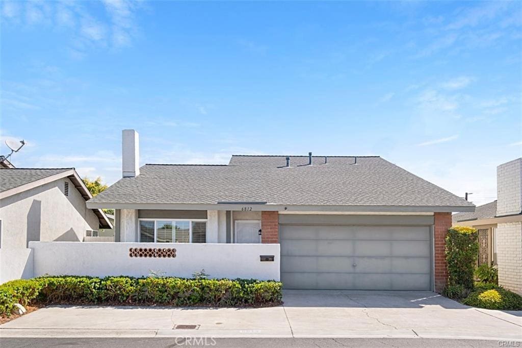 single story home featuring a garage