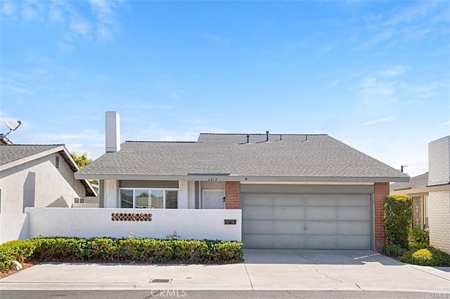 single story home featuring a garage