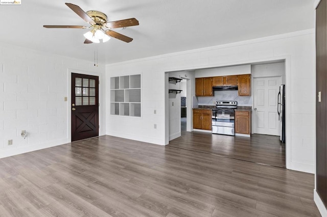 unfurnished living room featuring dark hardwood / wood-style floors and ceiling fan