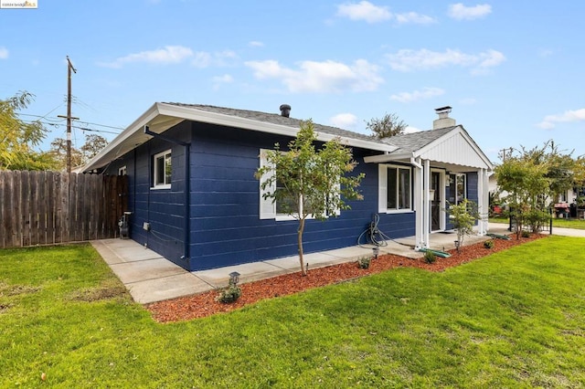 view of property exterior featuring a lawn