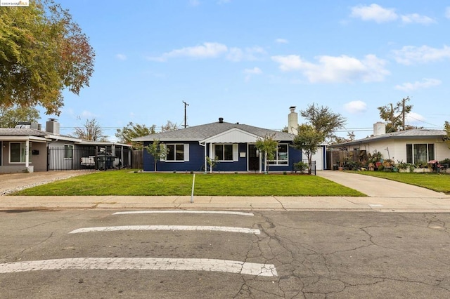 ranch-style home with a front lawn