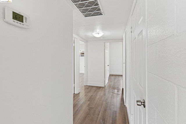 corridor with wood-type flooring