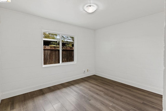 empty room with hardwood / wood-style flooring