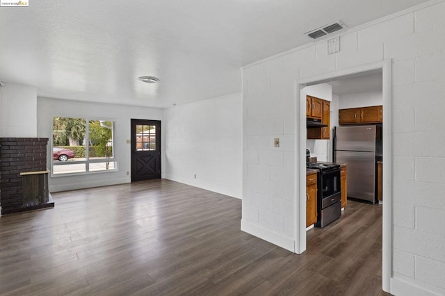 unfurnished living room featuring dark hardwood / wood-style floors