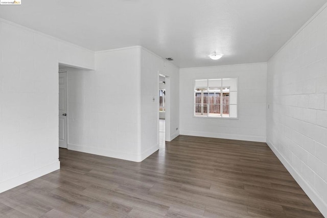 unfurnished room featuring dark wood-type flooring