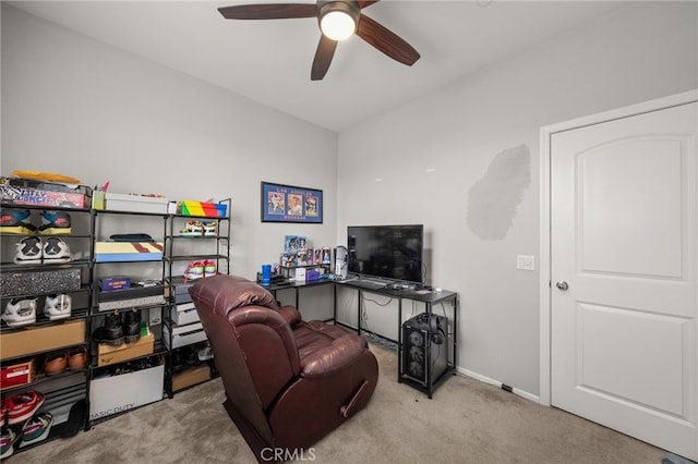 office area featuring light colored carpet and ceiling fan