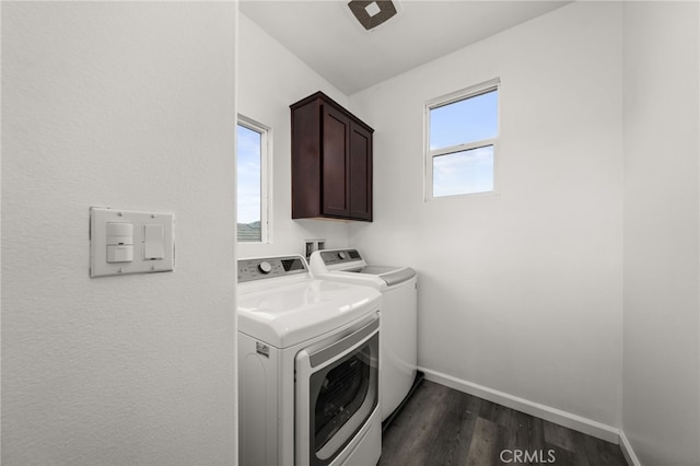 washroom with cabinets, dark hardwood / wood-style floors, and independent washer and dryer