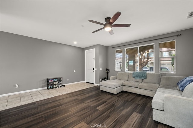 living room featuring hardwood / wood-style flooring and ceiling fan