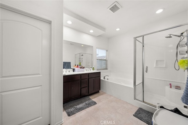 bathroom featuring vanity and plus walk in shower