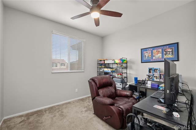 office space with ceiling fan and light colored carpet