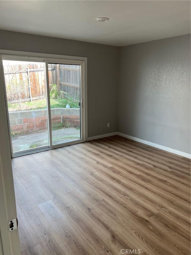 empty room with wood-type flooring