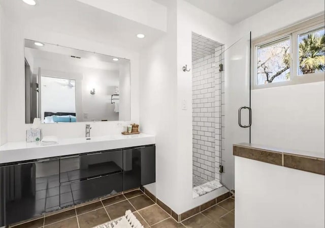 bathroom featuring tile patterned floors, vanity, and an enclosed shower