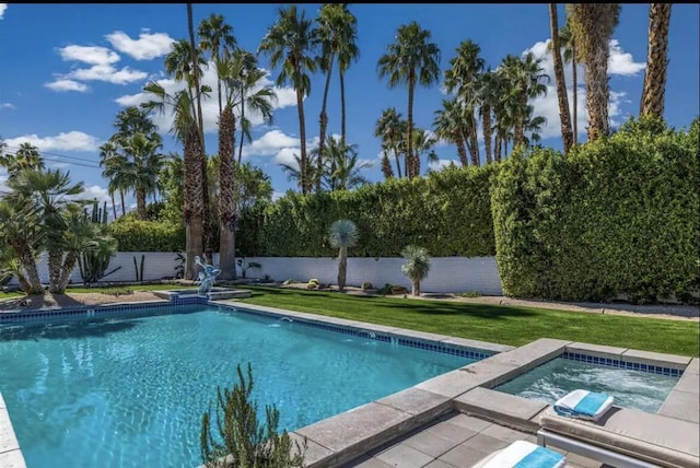 view of pool featuring an in ground hot tub and a lawn