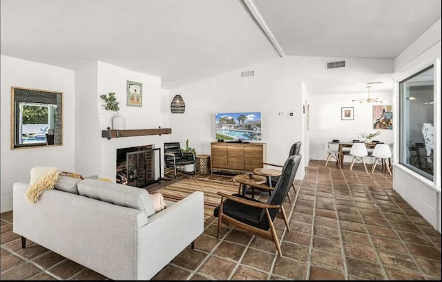 living room featuring lofted ceiling