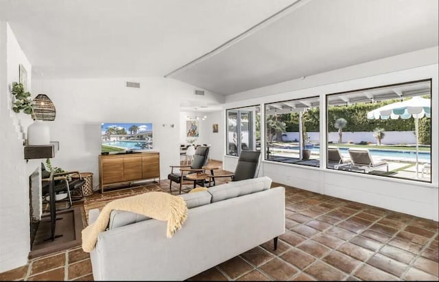 living room featuring lofted ceiling