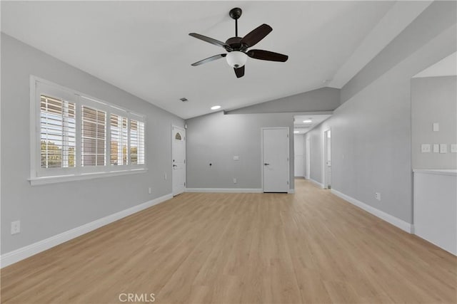 interior space featuring ceiling fan, lofted ceiling, and light hardwood / wood-style flooring