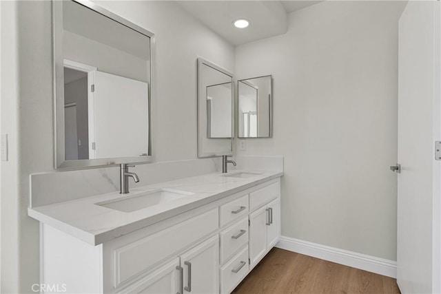 bathroom featuring vanity and wood-type flooring