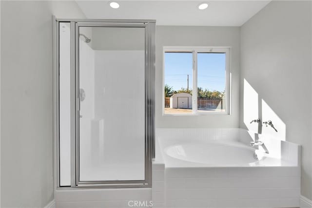 bathroom featuring plus walk in shower