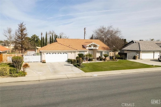 view of front of property with a garage and a front lawn