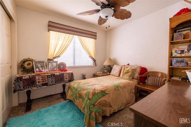 bedroom featuring ceiling fan, a closet, and carpet floors