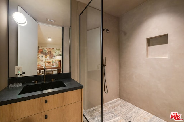 bathroom featuring vanity and walk in shower