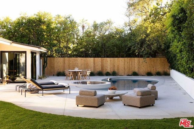 view of swimming pool featuring a patio