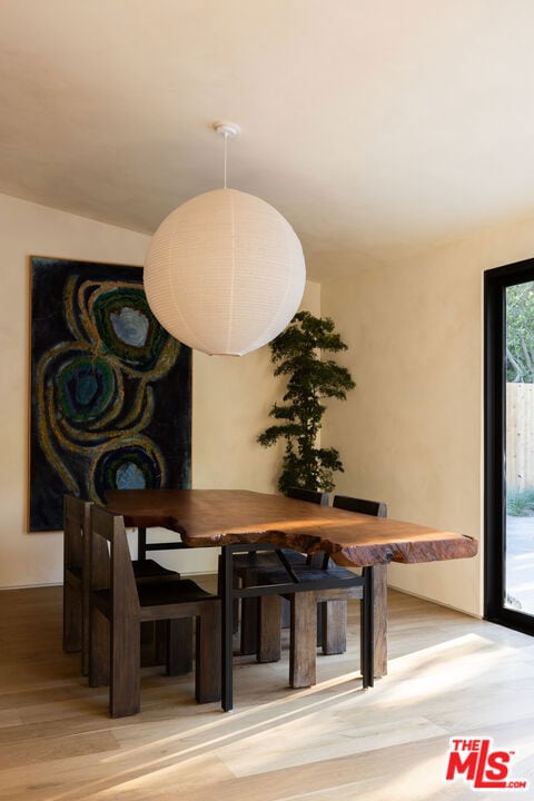 dining area featuring wood-type flooring